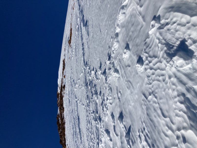 Wind scoured east face around 11k’ with raised boot pack tracks