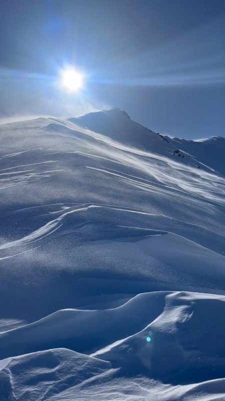 Sastrugi and blowing snow near treeline in Rock Creek.