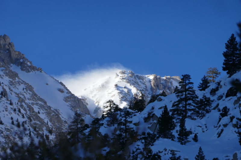 Incredible ridgetop winds on the approach. We couldn't tell if this was blowing snow or one of those crazy smoking mountain cloud caps when it is too windy. Maybe a mix of both? It was windy but didn't look this bad when we got up there.