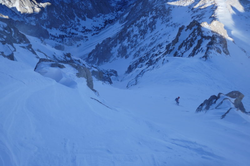 The crux entering the coulior from the ridge. Though steep and wind affected, the snow was firm and edgable, making for straight forward steep skiing. 