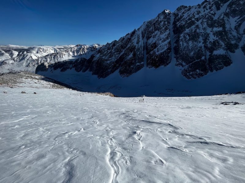 A combination of wind hardened and melt-freeze surface on an exposed SE aspect at 12000' in Bishop Creek. Softer surface conditions in the shaded and wind protected canyon below.