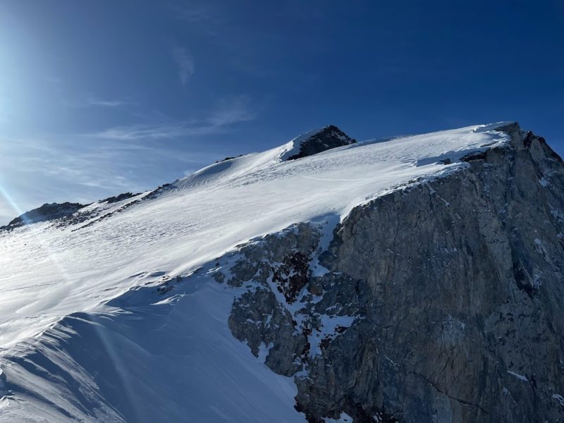 SE Face of Checkered Demon - Sastrugi and wind board. Ski Pen 0 - 10cm. The wind scoured entrance to the Checkered Demon couloir is visible in the foreground.