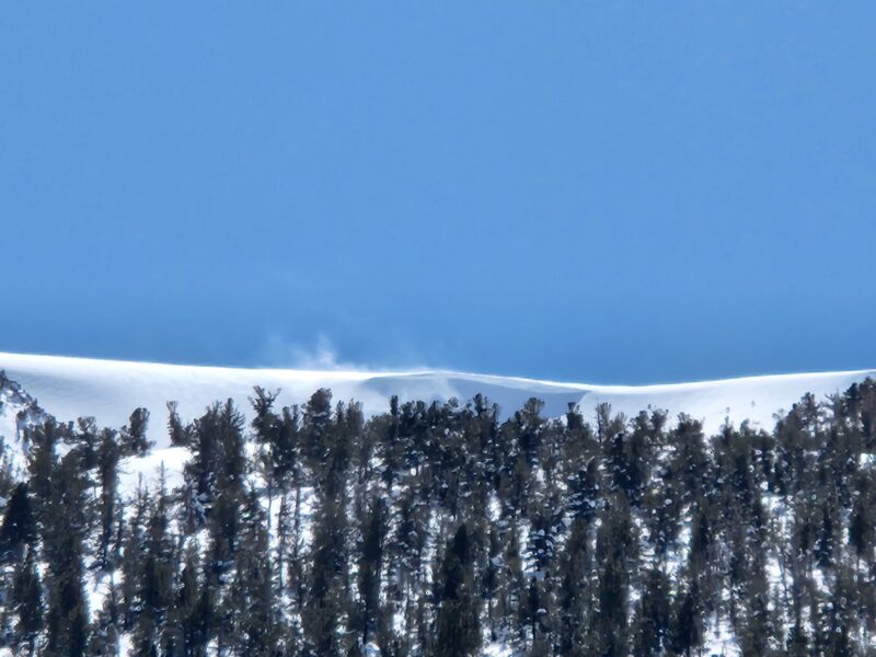 Periods of blowing snow at the ridges