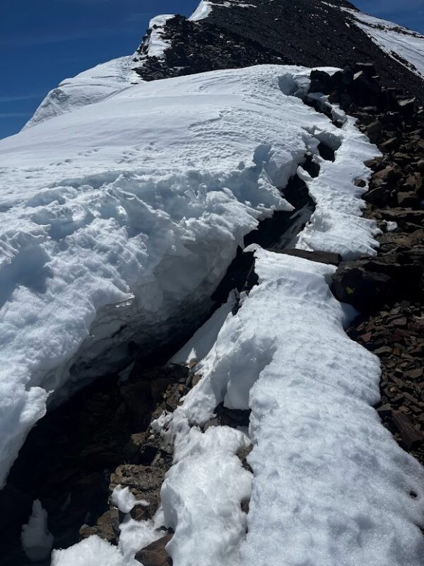 Melting root  of an overhanging cornice on the north ridge of WInuba. 4/21/23