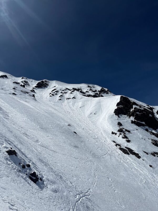 Surface snow was wet on steep NE and E faces at all elevations even up to 13,000'. Ski sunk in to boot-top in the ealry afternoon.