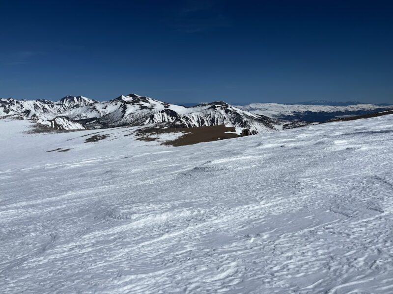 Dana Plateau conditions photo. Sastrugi on exposed windward terrain with a subtle northern tilt. Steeper slopes in leeward terrain tend towards smoother surfaces.