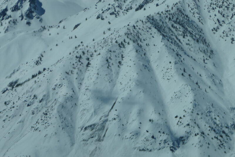 A blurry image of the start zone of the avalanche reported on Tom yesterday. Looks like it may indeed have been a wet slab. Upon zooming in there appears to be a crown up there. Others looked more like point releases. 
